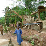 Bintu Lamidi continues to mix cement for the New Sacred Art team, as she has done over many decades